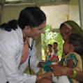Dr. Dani examining a child patient.