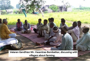 Veteran Gandhian Mr. Vasantrao Bombatkar, discussing with villagers about farming.