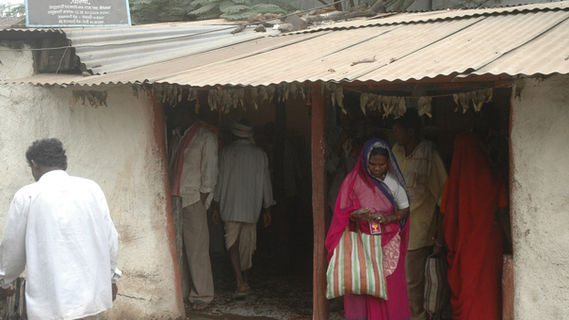 Tribal woman purchasing alcohol
