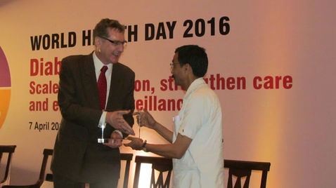 Dr. Ashish receiving WHO 'Public Health Champion' award from WHO India cheif Mr. Henk Bekedam for ou